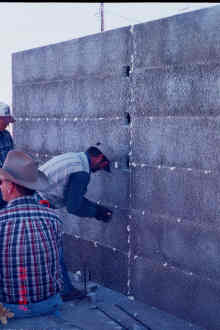 11/29 15:02 Holes are cut to allow rebar placement and grout to flow into interior fire wall.