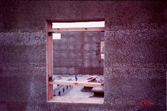 12/2/00 Day #3 Placement of braces is necessary in window and door openings prior to grouting.