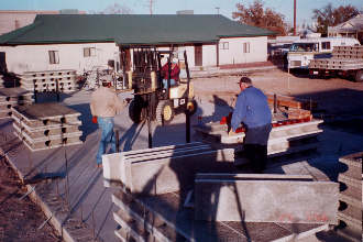 11/29 7:56 The use of a forklift to place elements on slab is a labor-saving convenience.